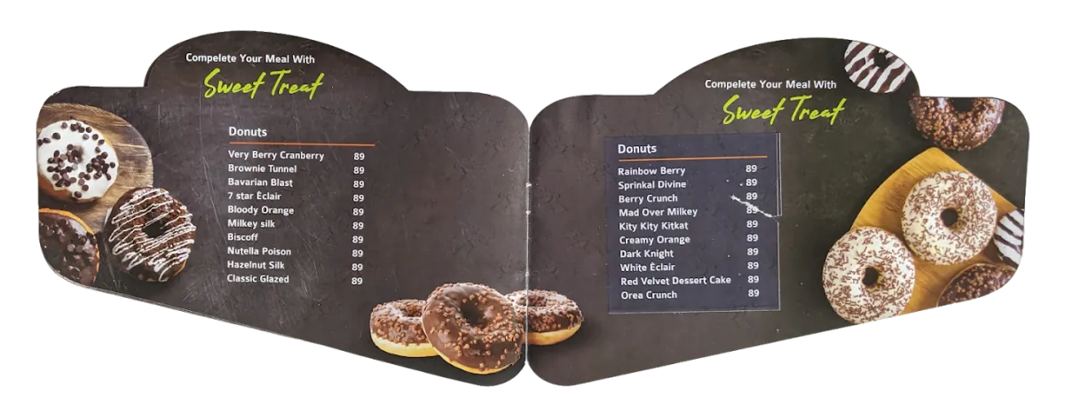 Donut display case showcasing fresh handmade donuts at JBee's